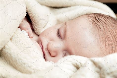 Baby sleeping covered with blanket | High-Quality People Images ~ Creative Market