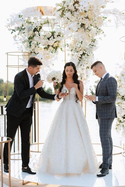 Premium Photo | Wedding ceremony of the newlyweds on the pier