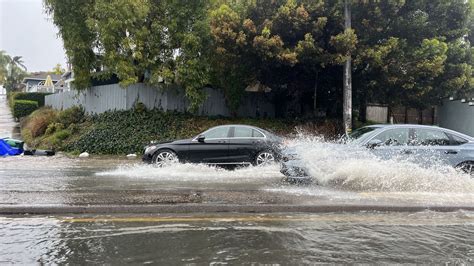 Historic rain overwhelms San Diego causing severe flooding - Axios San ...