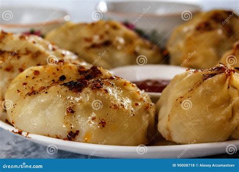 Manti on a Plate with Sauce. Traditional Food of the Inhabitants of ...