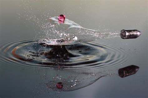 Bullets Slicing Water Drops – High Speed Photography