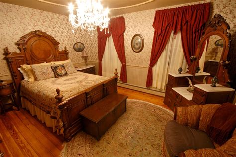 Victorian Style Bedroom- Lots of curved lines, elaborate furnishing and drapery. dark wood ...