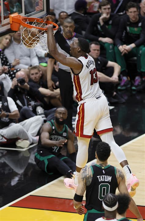 Miami Heat center Bam Adebayo (13) dunks during the first half against the Boston Celtics in ...