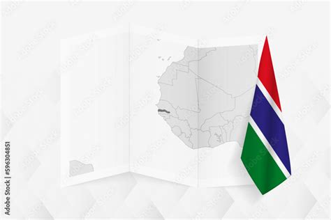 A grayscale map of Gambia with a hanging Gambian flag on one side. Vector map for many types of ...