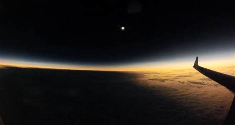 wordlessTech | Moon shadow during Solar Eclipse from an airplane