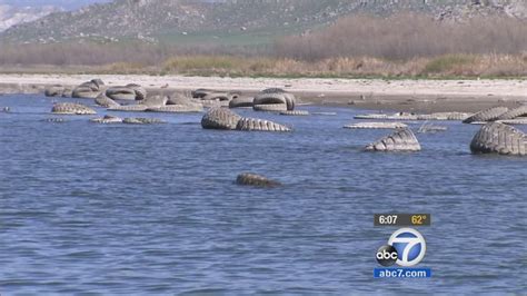 Dozens of tires surface at Lake Perris as water level drops amid ...