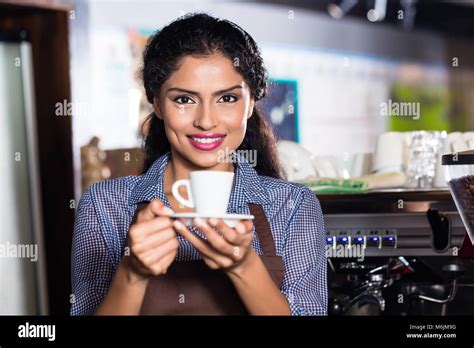 Barista with espresso in Indian cafe Stock Photo - Alamy