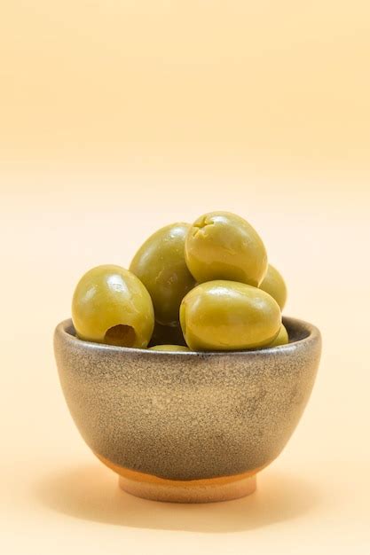 Premium Photo | Small ceramic bowl with olives of the gordal type typical appetizer in the ...
