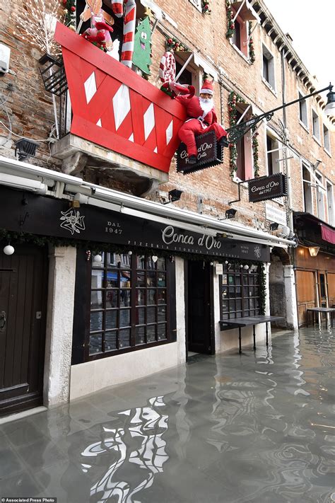 Venice is hit by 'exceptional' new flooding weeks after the historic city was swamped by huge ...