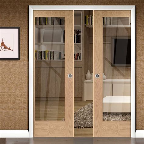 Pattern 10 Oak Double Evokit Pocket Doors - Clear Glass - Prefinished