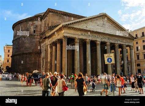 Ancient pantheon exterior daytime with crowded square in Rome, Italy ...