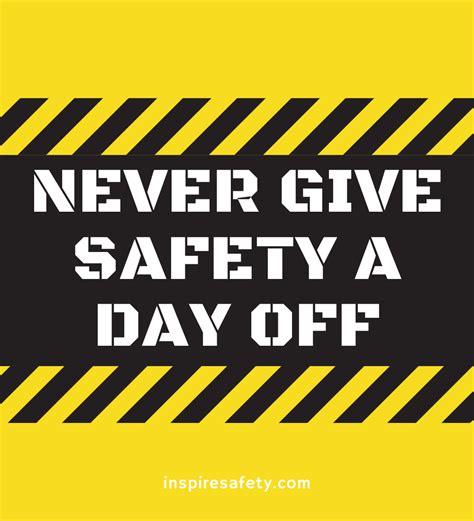 A construction safety slogan reading "never give safety a day off" on a yellow and black striped ...