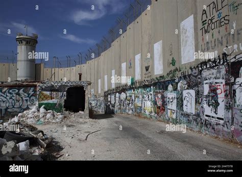 Political graffiti painted on the Palestinian side of the Wall of Separation or Israeli West ...