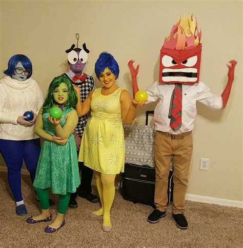 three people in costumes standing next to each other