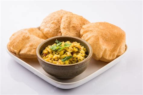 Premium Photo | Puri Bhaji - Indian semi dry Potato Spicy recipe also known as Batata or Aloo ki ...