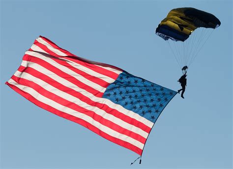 Flag Flying High | A Navy parachutist descends with the Amer… | Flickr