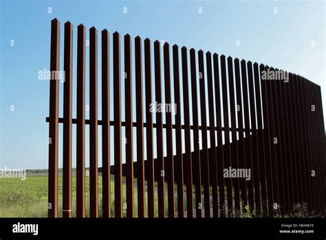 Border fence along the Texas-Mexico border near Brownsville, Texas ...