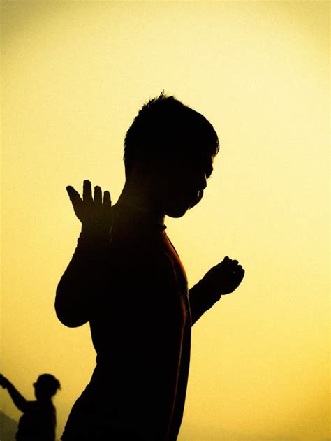 Silhouette of a Child Standing During Sunset · Free Stock Photo