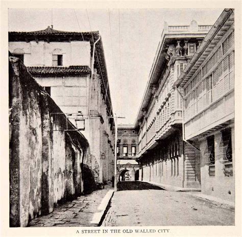 A street in the old walled city of Intramuros, Manila circa 1908 ...