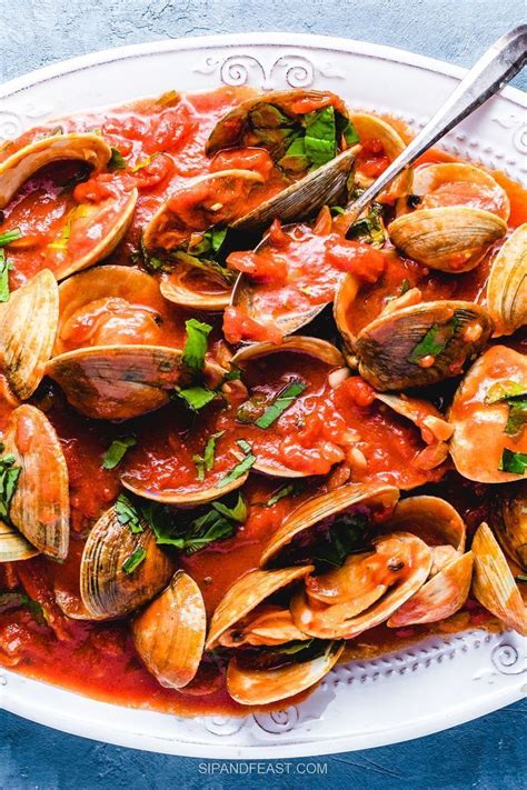 Clams in Red Sauce satisfies that seafood craving! Steamed clams are tossed in a delicious ...