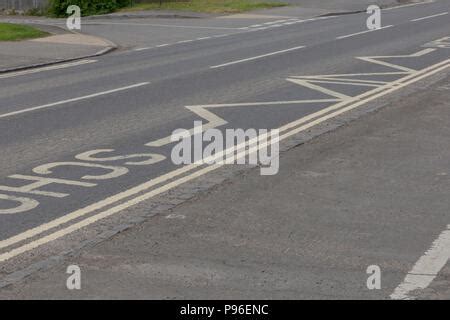 Road Markings in Carterton, Oxfordshire UK. 13th May 2018. UK Weather: Give Way signs in ...