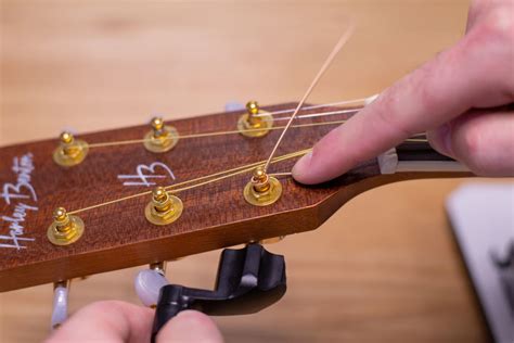 How to Change Guitar Strings (Guide) | Yousician