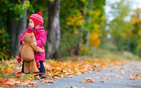 Child girl bear toy autumn leaves nature photo hd wallpaper