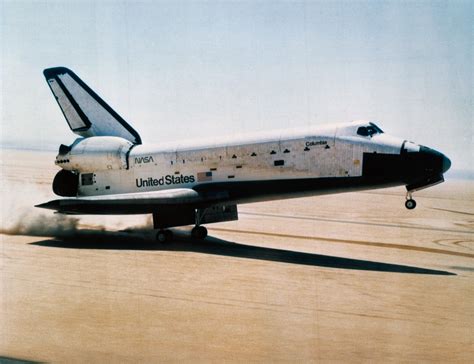 The space shuttle orbiter Columbia touching down at Edwards Air Force Base on April 14, 1981 ...