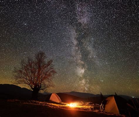 Premium Photo | Night camping in mountain valley under starry sky