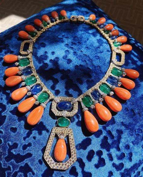 David Webb on Instagram: "Glorious and colorful, this coral, sapphire, emerald, and diamond ...