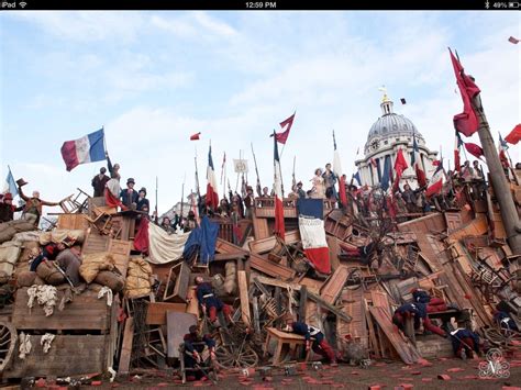 Les Mis (2012) | The Barricade -- note Amanda Seyfried (Cosette) and Eddie Redmayne (Marius ...