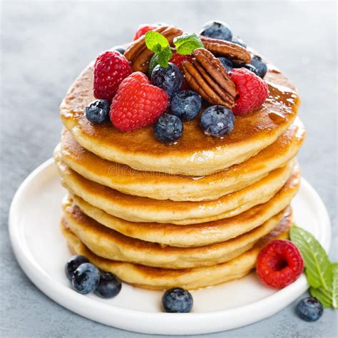 Stack of Fluffy Pancakes with Fresh Berries and Pecan Nuts Stock Photo - Image of light, cook ...