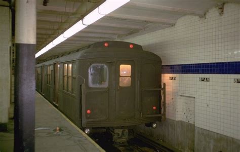 a subway train is stopped at the station