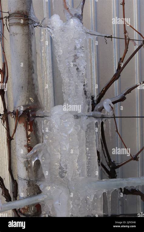 Icicles formation formed after a drastic change in the weather at a household Stock Photo - Alamy