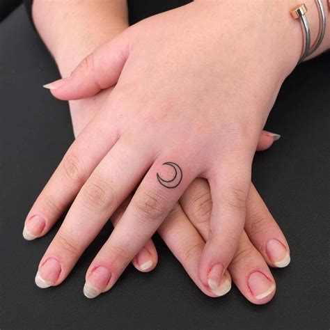 Tiny moon tattoo by Indy Voet - Tattoogrid.net