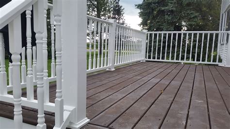 TRX white vinyl railing with colonial balusters and a treated pine ...