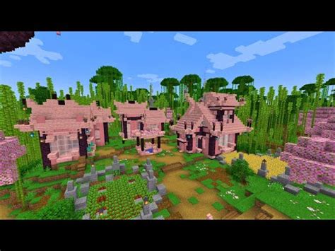 a minecraft village with lots of trees and bushes