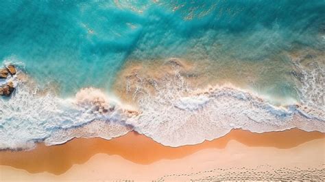 Premium AI Image | An aerial view of a beach with a blue ocean and pink sand.