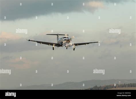 Single turboprop aircraft Pilatus PC-12 landing aircraft Stock Photo - Alamy