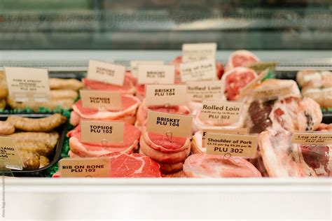 "Butcher's Shop Meat Display Counter" by Stocksy Contributor "Kirsty Begg" - Stocksy