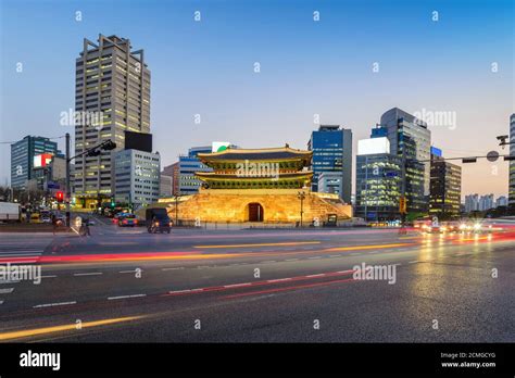 Namdaemun Gate and city skyline at night, Seoul, South Korea Stock ...