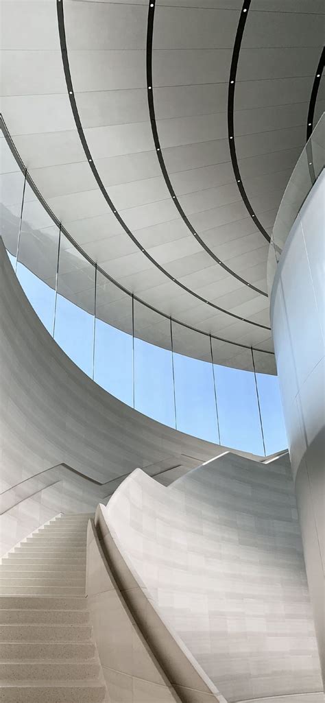 the interior of a modern building with curved walls