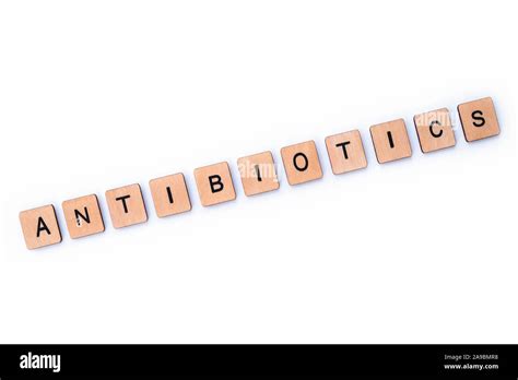 The word ANTIBIOTICS, spelt with wooden letter tiles over a white background Stock Photo - Alamy