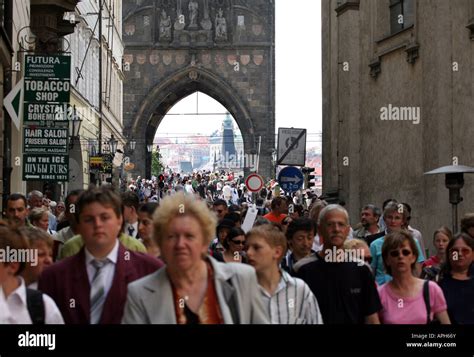 Bustling crowd in front of the entrance to Charles Bridge, Prague Stock Photo - Alamy