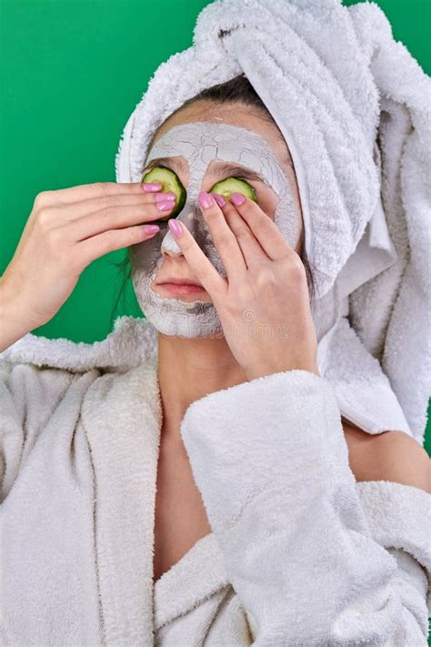 Woman`s Applying Cucumber Slices on Her Eyes. Stock Photo - Image of cosmetology, happy: 197659572