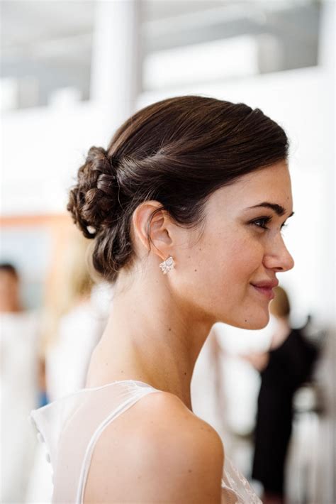 A braided bun bridal hairstyle | Wedding Day Hair | Bride hairstyles, Wedding hairstyles for ...