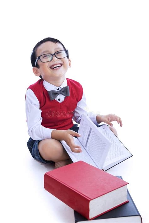 Boy Laughing Reading Books Stock Photography - Image: 33094912