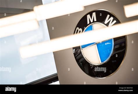 21 March 2018, Germany, Munich: Car company BMW's logo looms large on ...