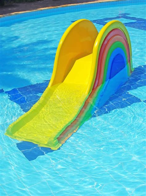 Children s slide in pool stock photo. Image of vacations - 10494312