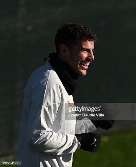 Theo Hernandez of AC Milan smiles during a AC Milan training session ...